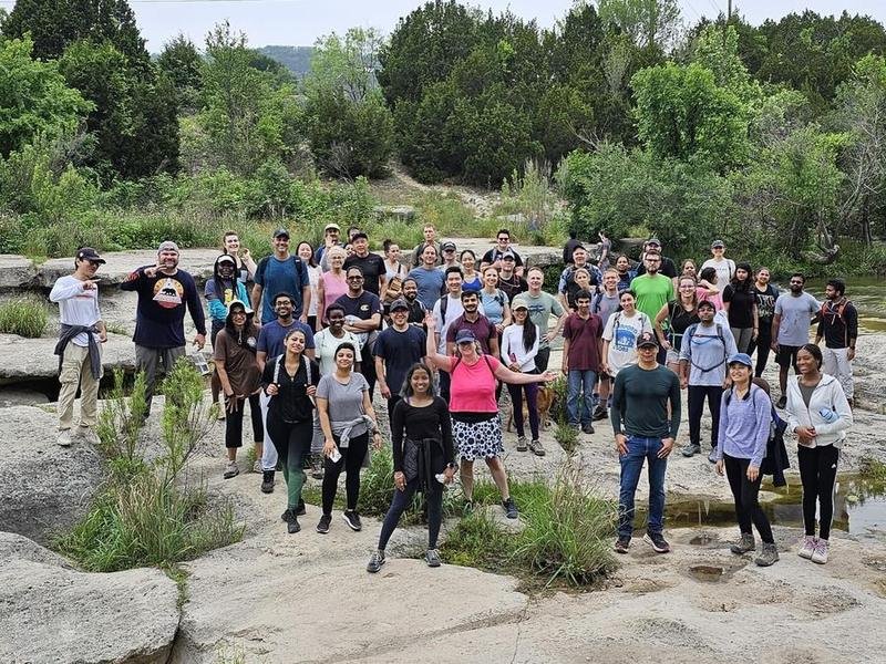 A large Wander and Hike group on the limestone at Bull Creek District Park, Austin