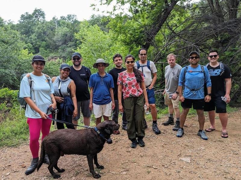 A Wander and Hike group with a dog on the trail at Colorado Bend State Park, Texas