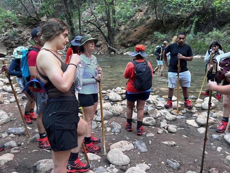 Wander and Hike members wading the Virgin River in the Narrows, Zion National Park, Utah